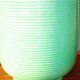 Enamelled earthenware vase with striated pattern
