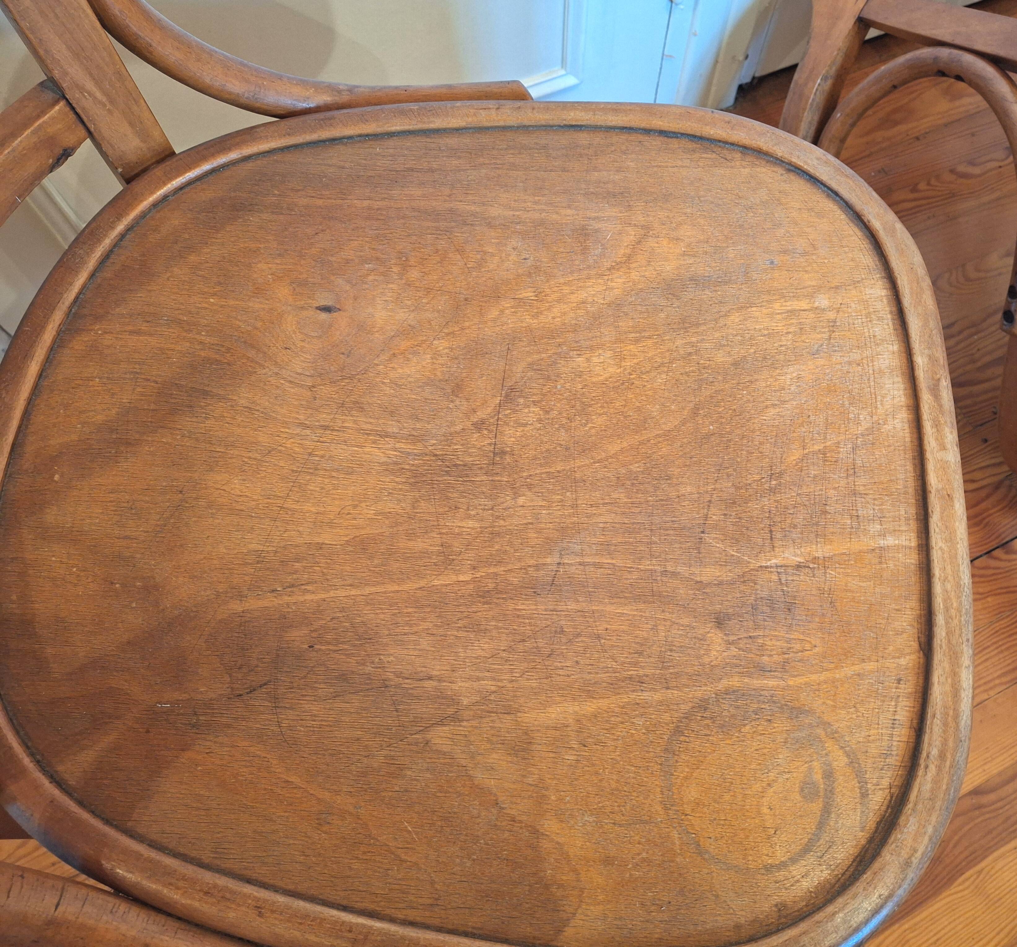 Curved wooden armchair