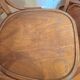 Curved wooden armchair