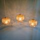 Vintage trio of amber glass pendants, 1960s-70s.