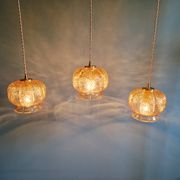 Vintage trio of amber glass pendants, 1960s-70s.