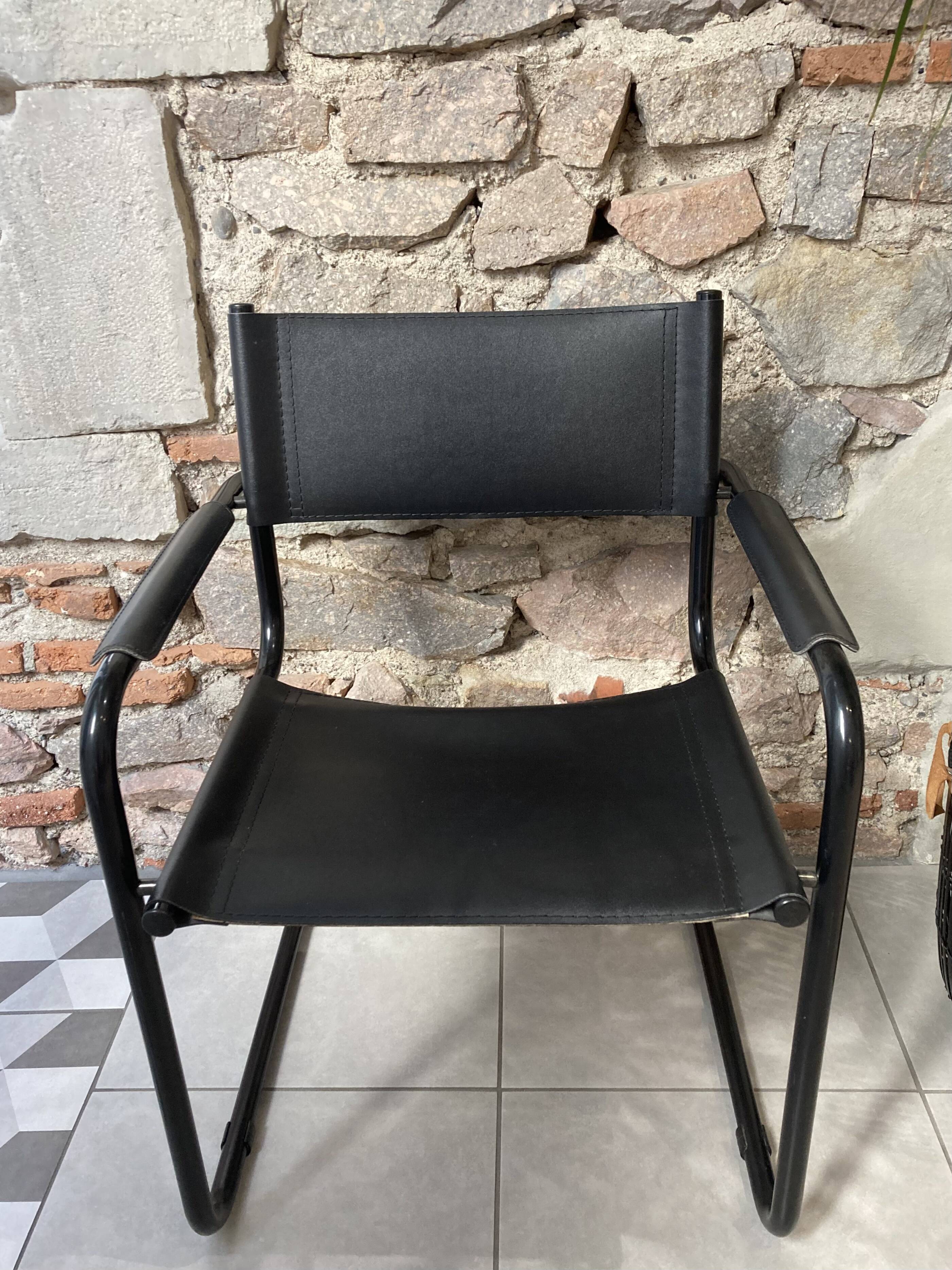 Armchair in black lacquered metal