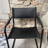 Armchair in black lacquered metal