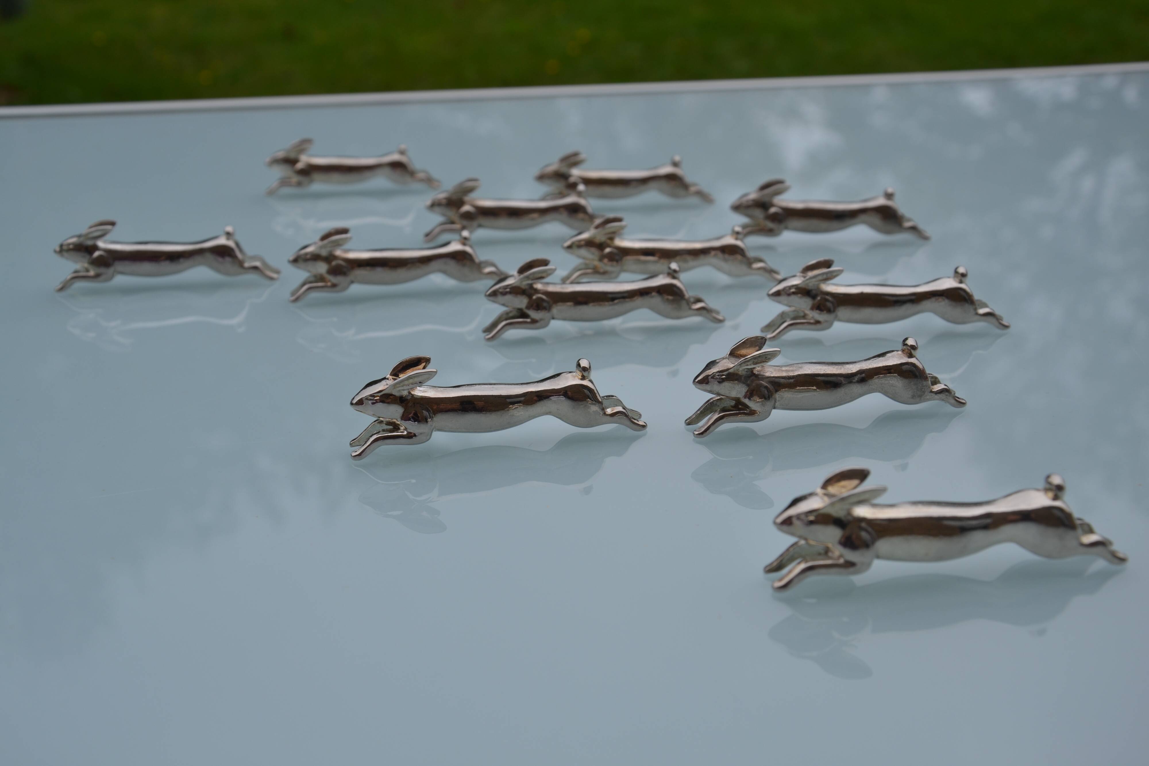 12 silver-plated metal "rabbit" knife rests