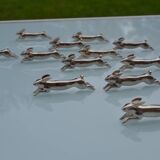 12 silver-plated metal "rabbit" knife rests