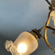 Ancien lustre cage en bronze et 4 feux tulipe