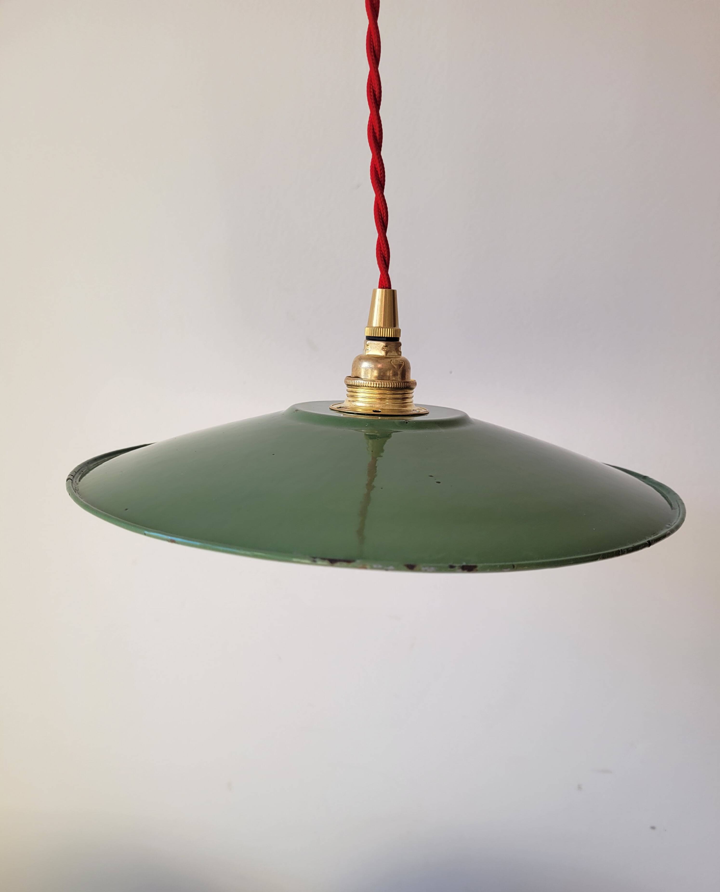 Trio of enameled sheet metal pendant lights