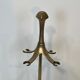 Neoclassical brass fire accessory.