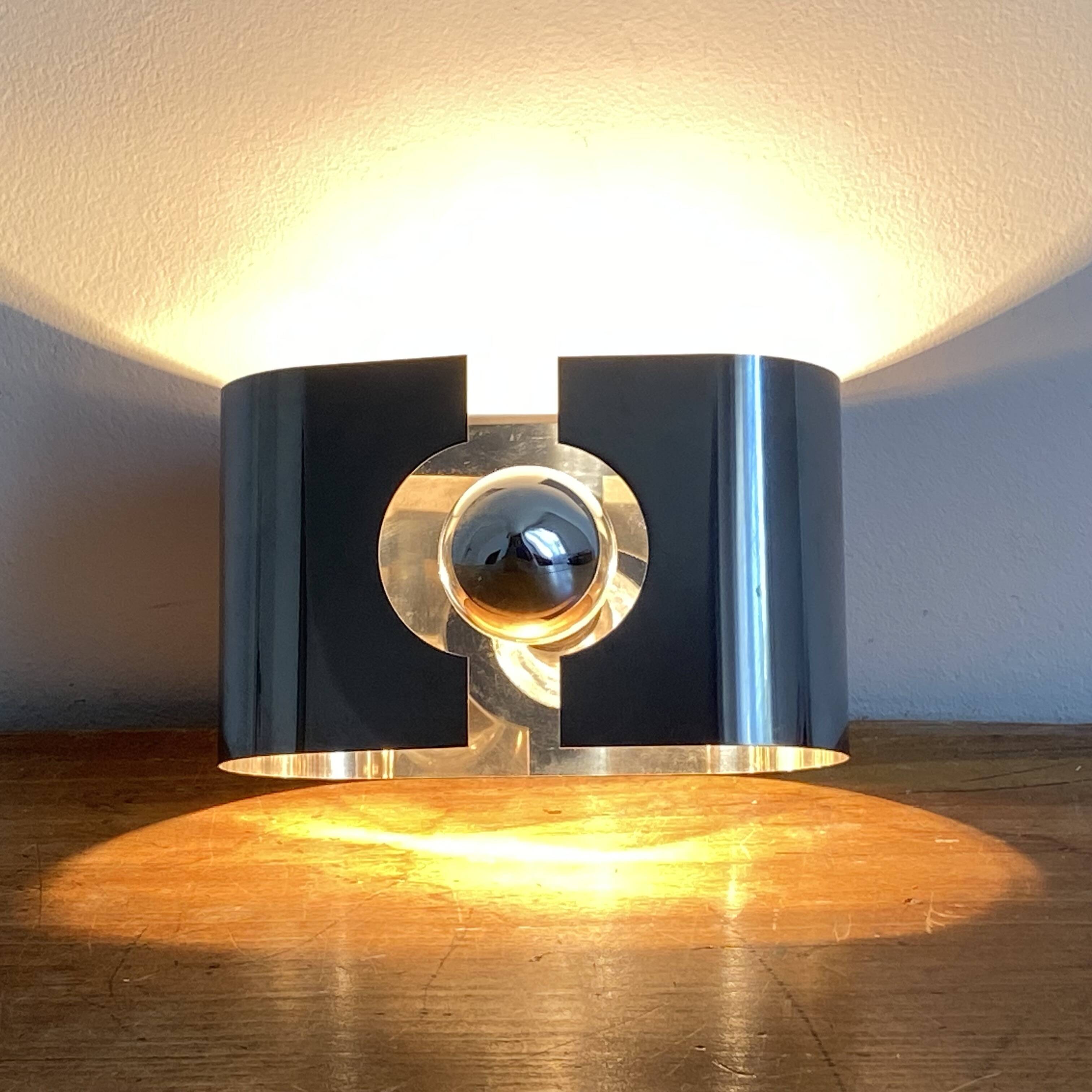 Space age wall light. 1970. Chrome steel.