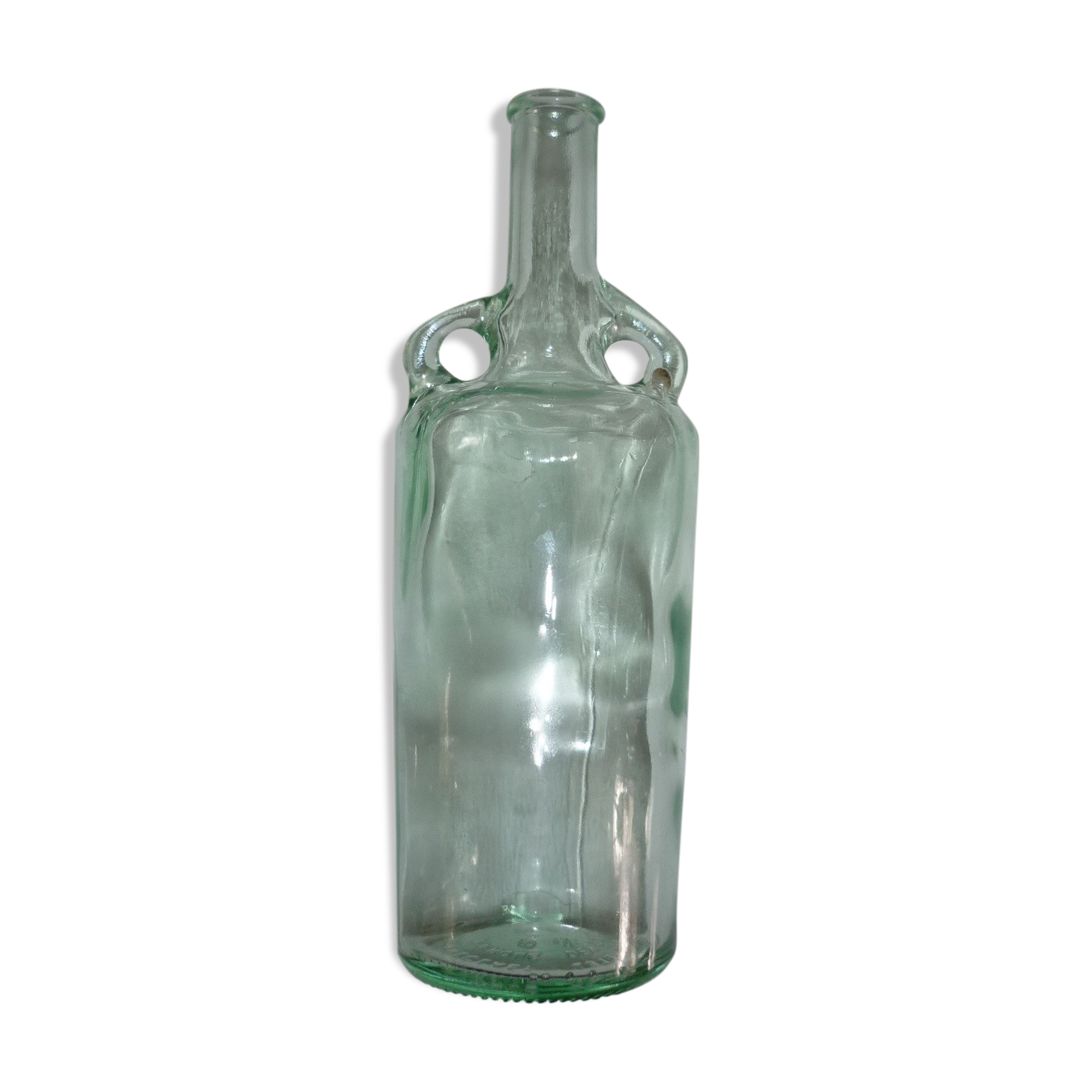 Old transparent moulded glass bottle