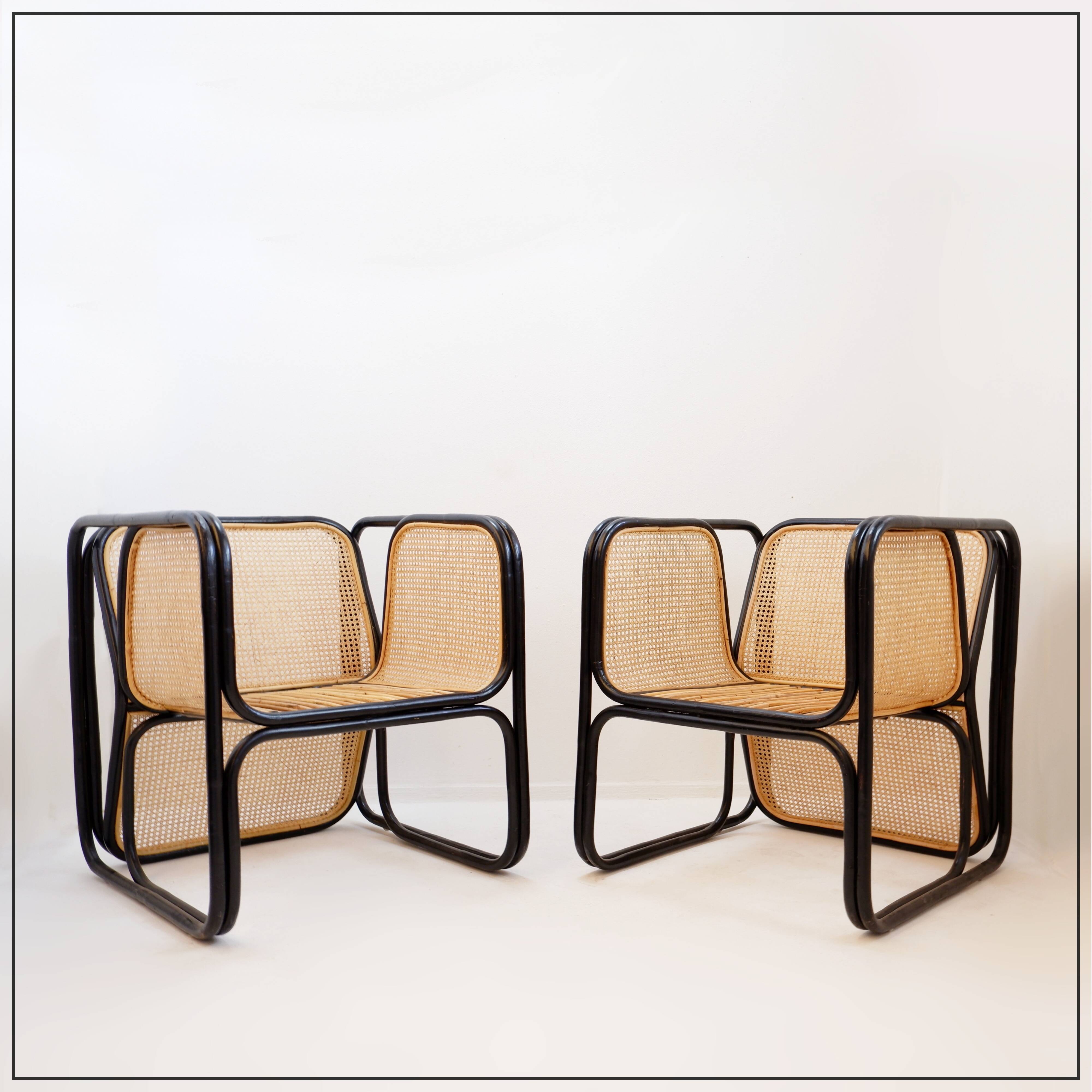 Pair of designer armchairs in curved wood and wicker