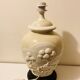 1980s ceramic table lamp with a wooden base and adjustable shade.