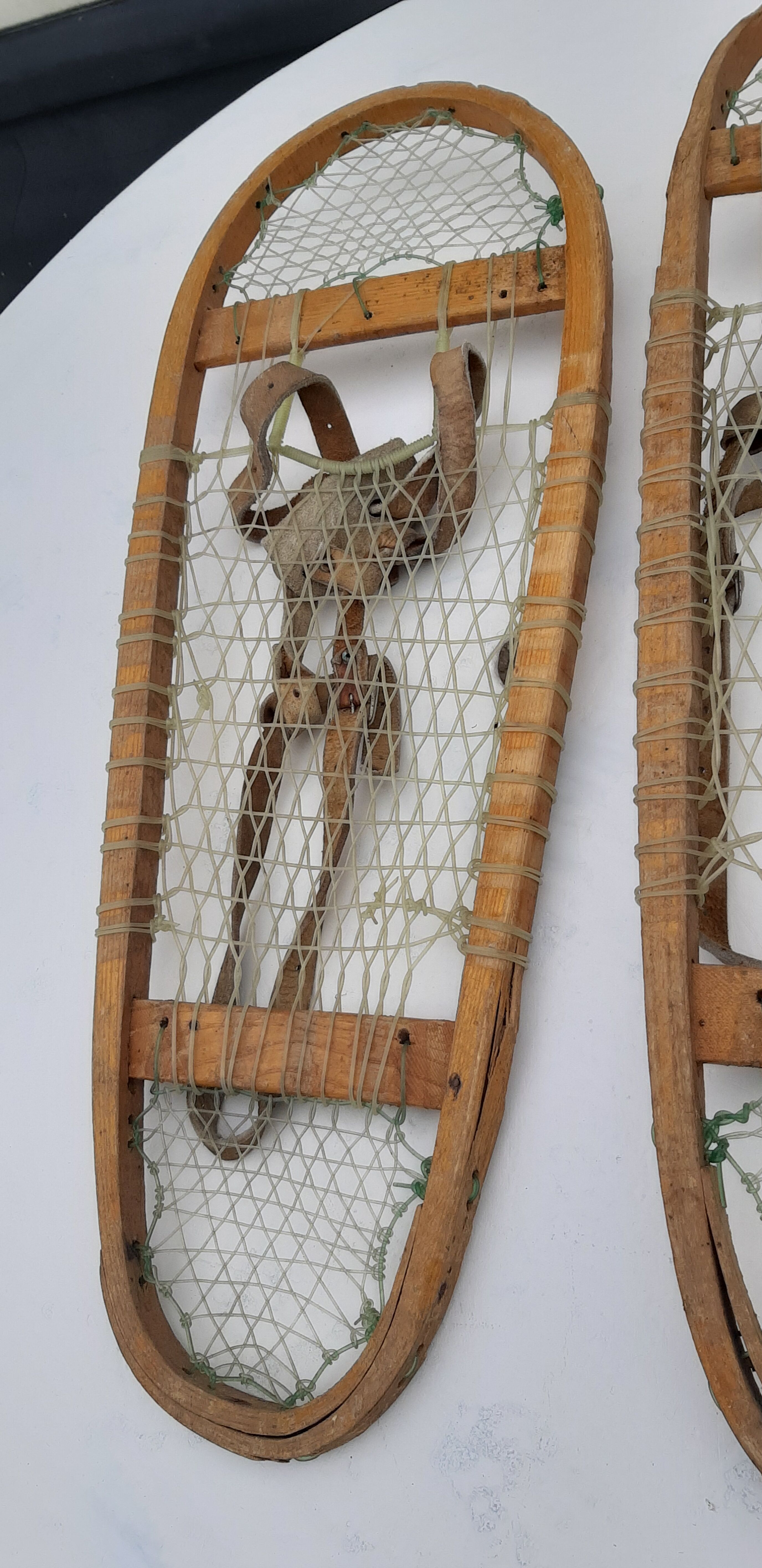 Old snowshoes made of wood and hoses