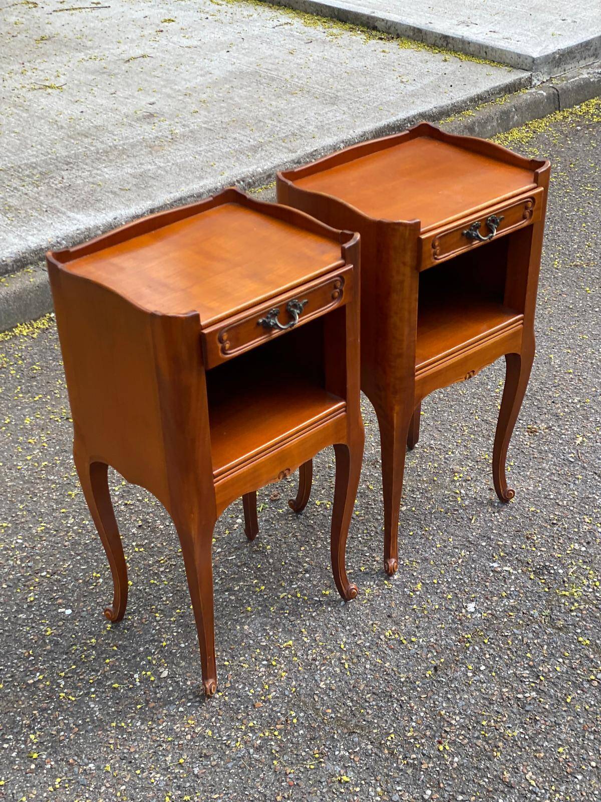 2 Louis XV bedside tables made of curved solid wood with drawers.