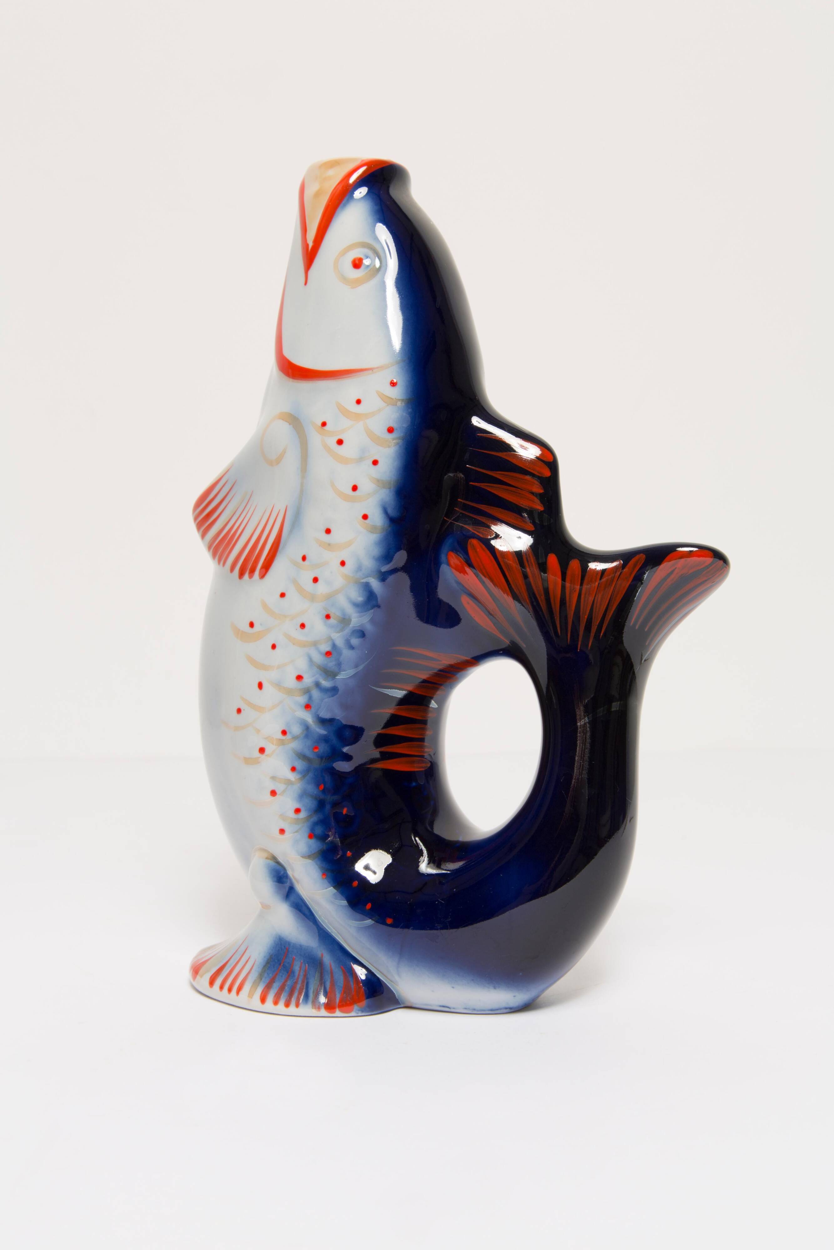Set of 7 blue glass fish, mid-20th century.