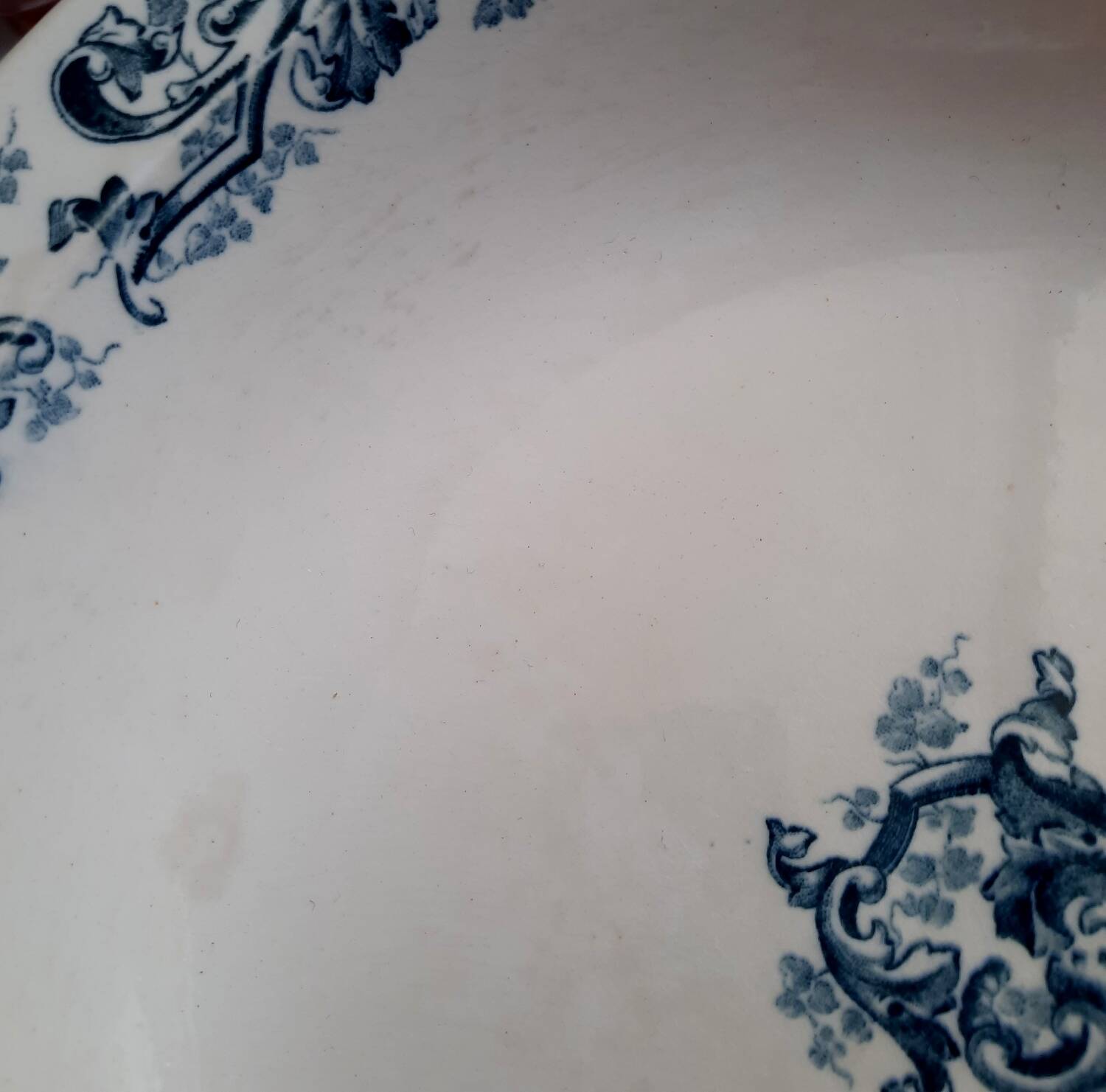 Old mismatched dinner plates accompanied by a dish