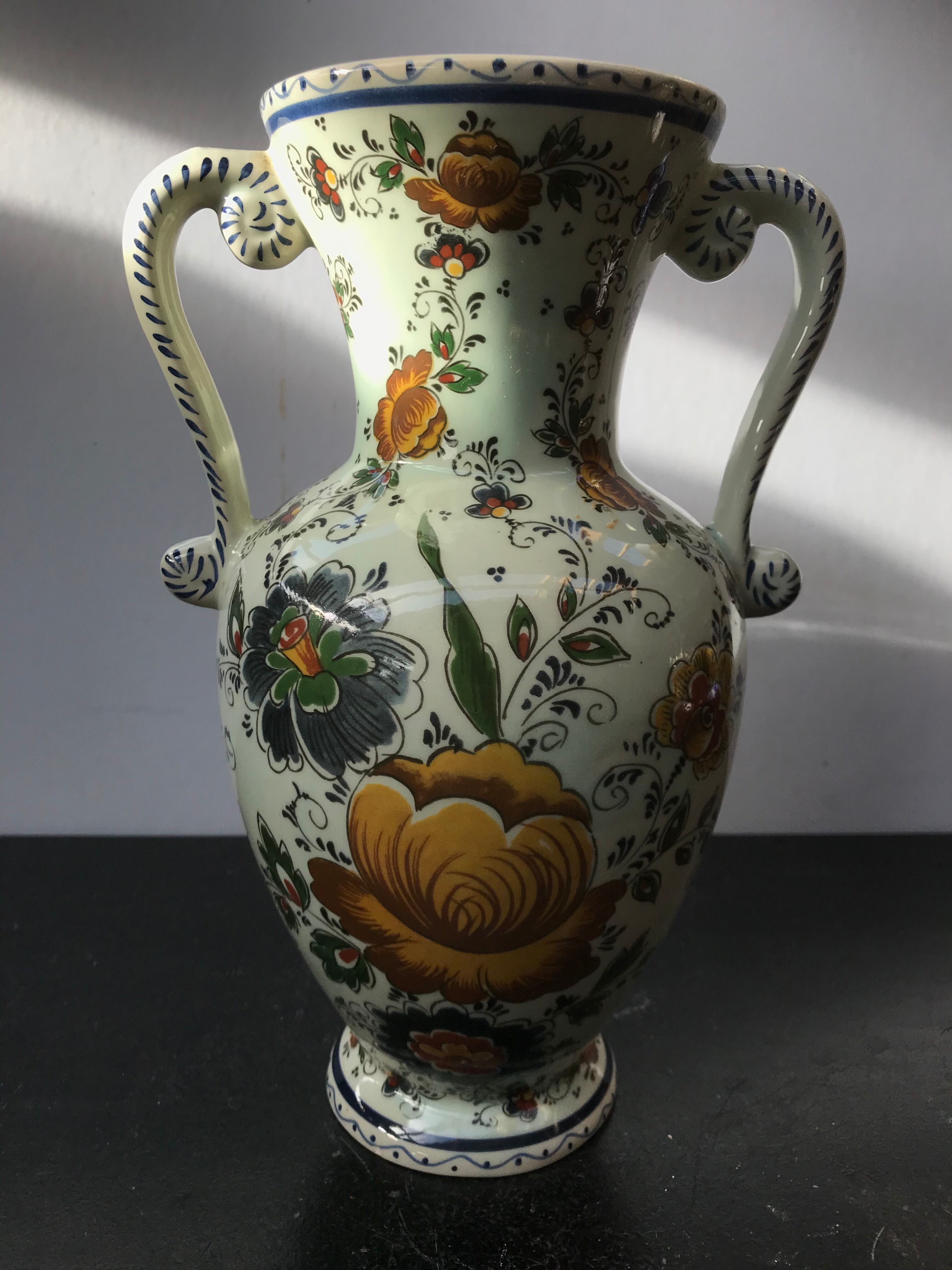 Ancient Delft vase with white ceramics decor vintage flowers