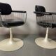 A striking set of four vintage swivel dining chairs