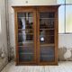 Glass-fronted walnut library 1900