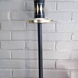 Vintage floor ashtray with a gold and black metal cigarette dispenser.