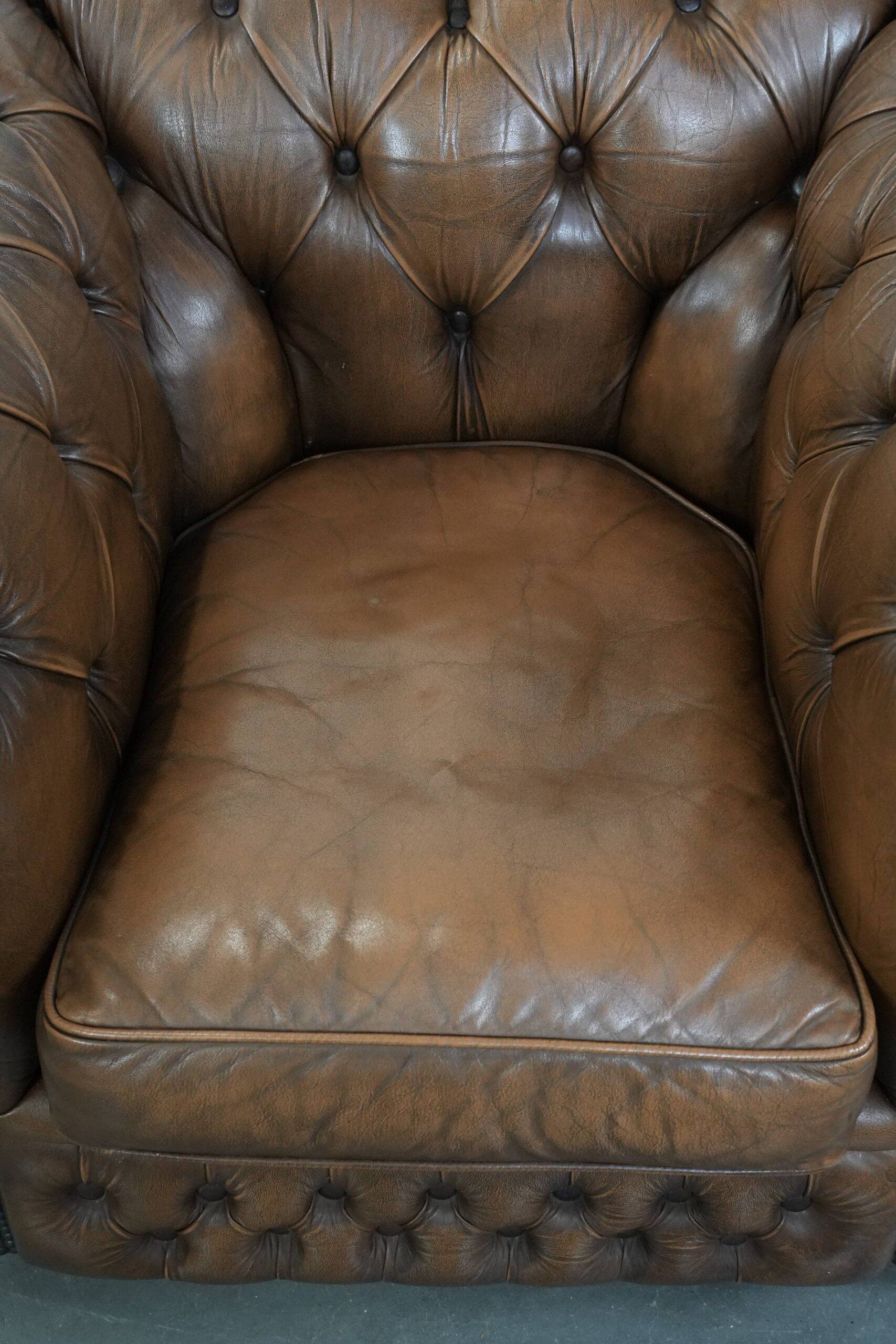 Brown cowhide leather chesterfield armchair  in English style on wheels