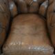 Brown cowhide leather chesterfield armchair  in English style on wheels
