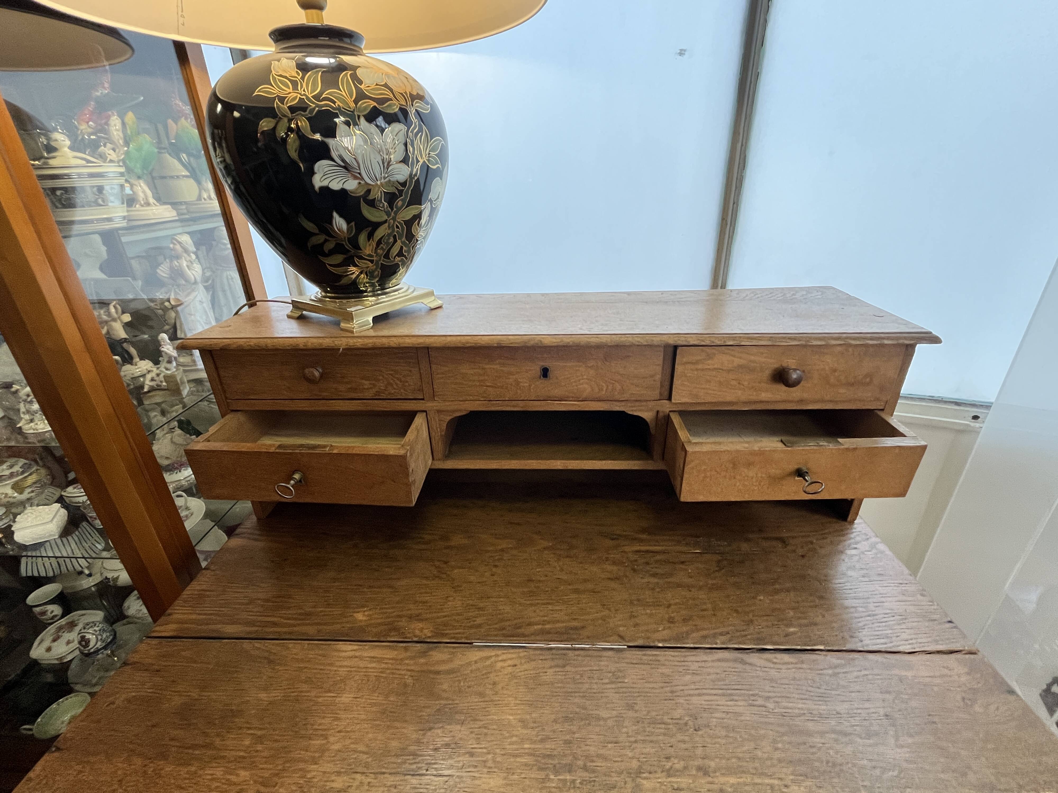 Antique oak tiered desk with stretcher, early 20th century.