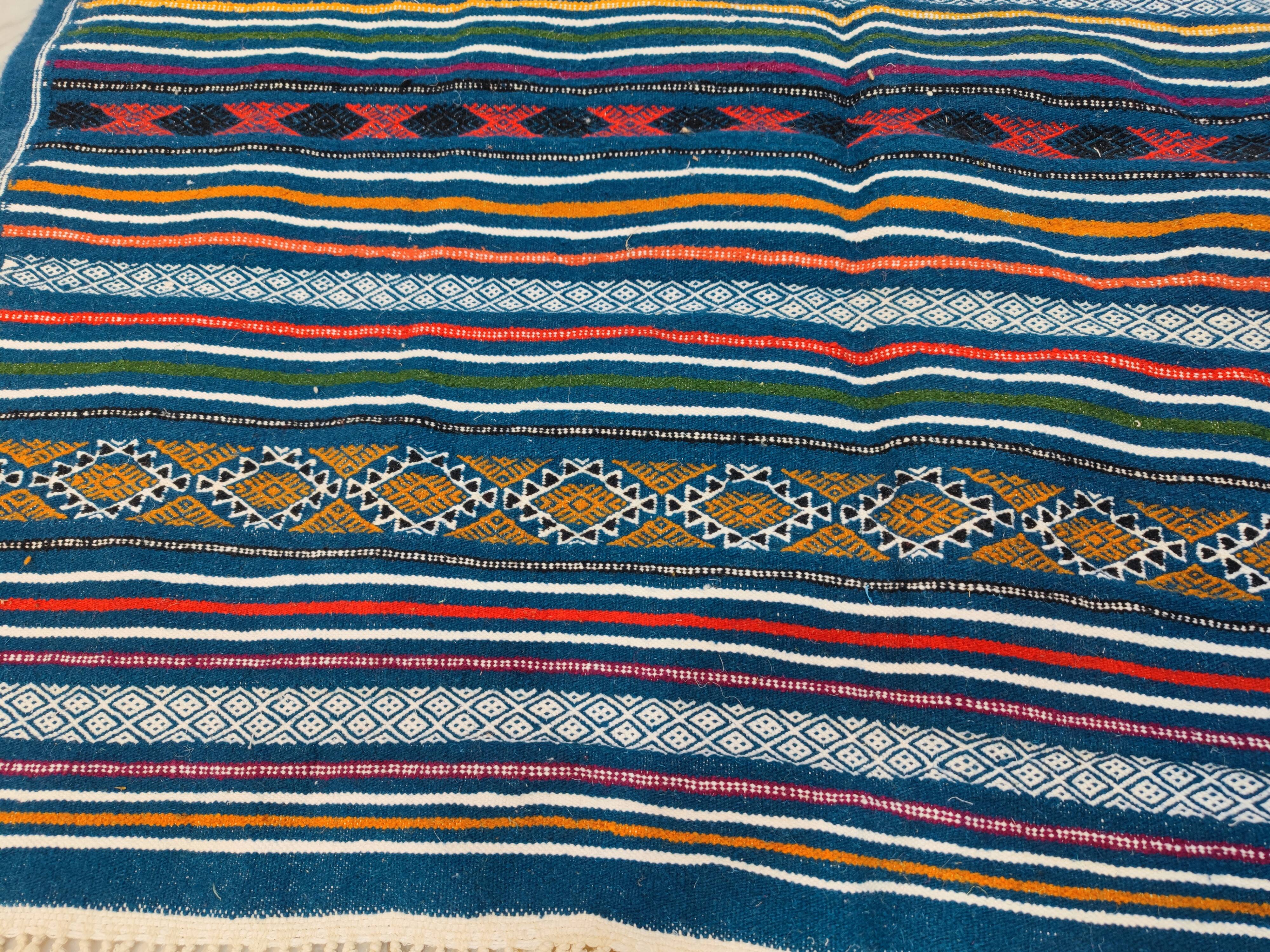 Handwoven blue kilim rug in natural wool