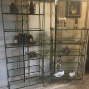 Pair of wrought iron and glass bookshelf shelves.