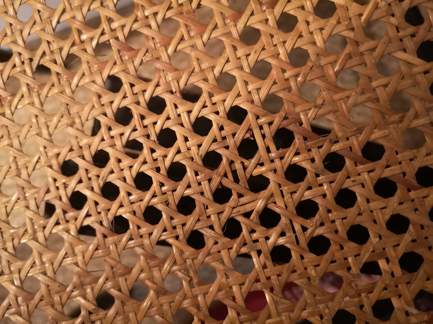 Blackened wooden chairs and cannage around 1980