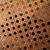 Blackened wooden chairs and cannage around 1980