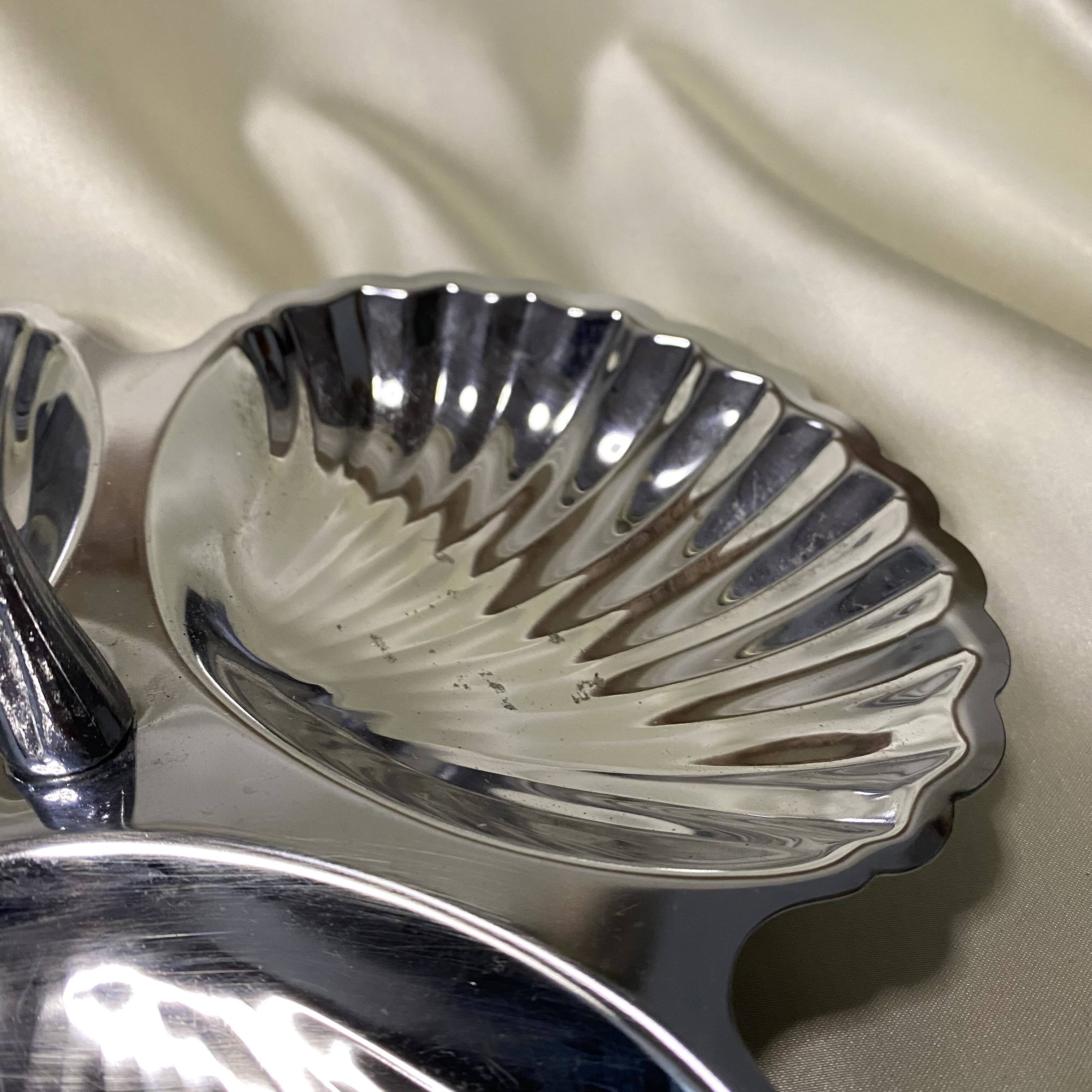 Stainless steel serving platter in the shape of seashells