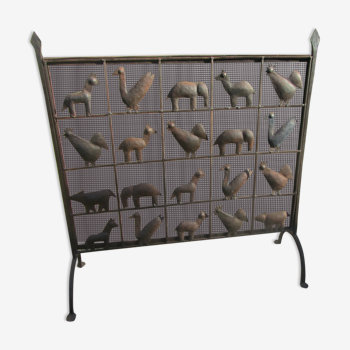 Wrought iron fireplace screen decorated with animals, 1950s