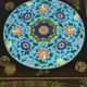 Black lacquered wooden coffee table with cloisonné and polychrome decoration, 20th century.