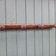 Small antique wooden wall coat rack.