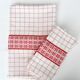 White and red embroidered tablecloth and eight matching napkins, 200x150cm