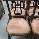 Set of 6 vintage curved wooden chairs, adorned with an elegant black lyre-shaped backrest.