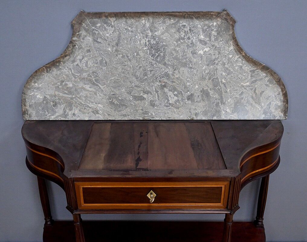 Console in mahogany and marble, Louis XVI period – late 18th century.