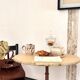 Cast iron base side table with a stone-effect top.