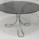 Living room table "Space Age" polished steel, circular slab smoked glass. France, circa 1970.