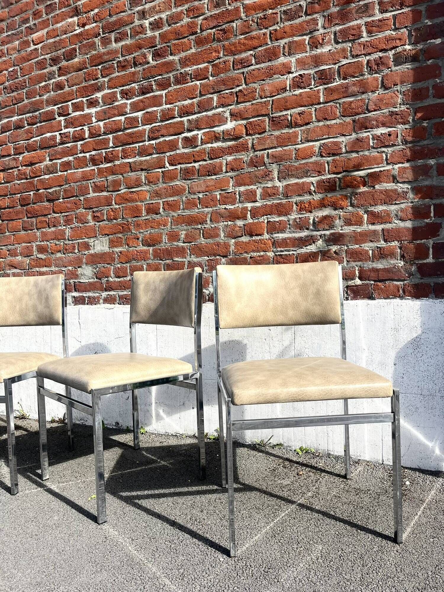 Set of 4 vintage chairs in chrome and faux leather.