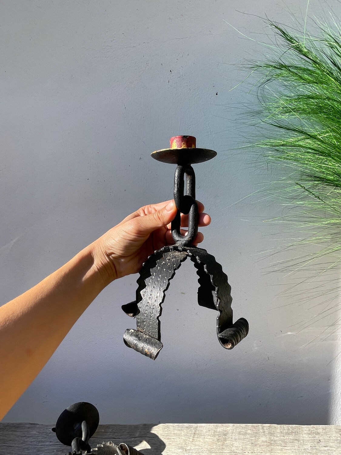 Pair of candlesticks with wrought iron chain