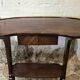 Kidney-shaped table in mahogany veneer, Louis XVI style, 20th century.