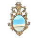 Miroir en bois doré sculpté .