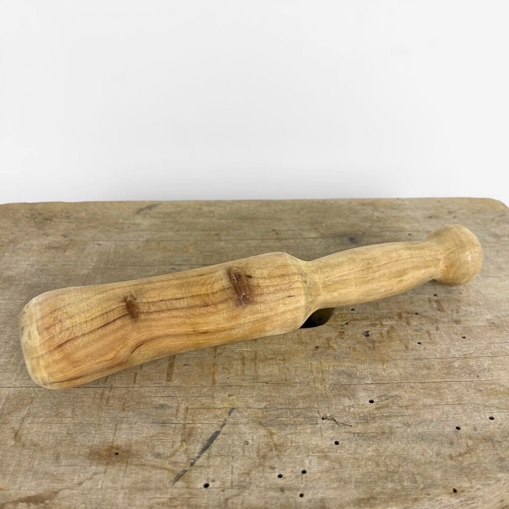 Mortar and old pestle made of olive wood
