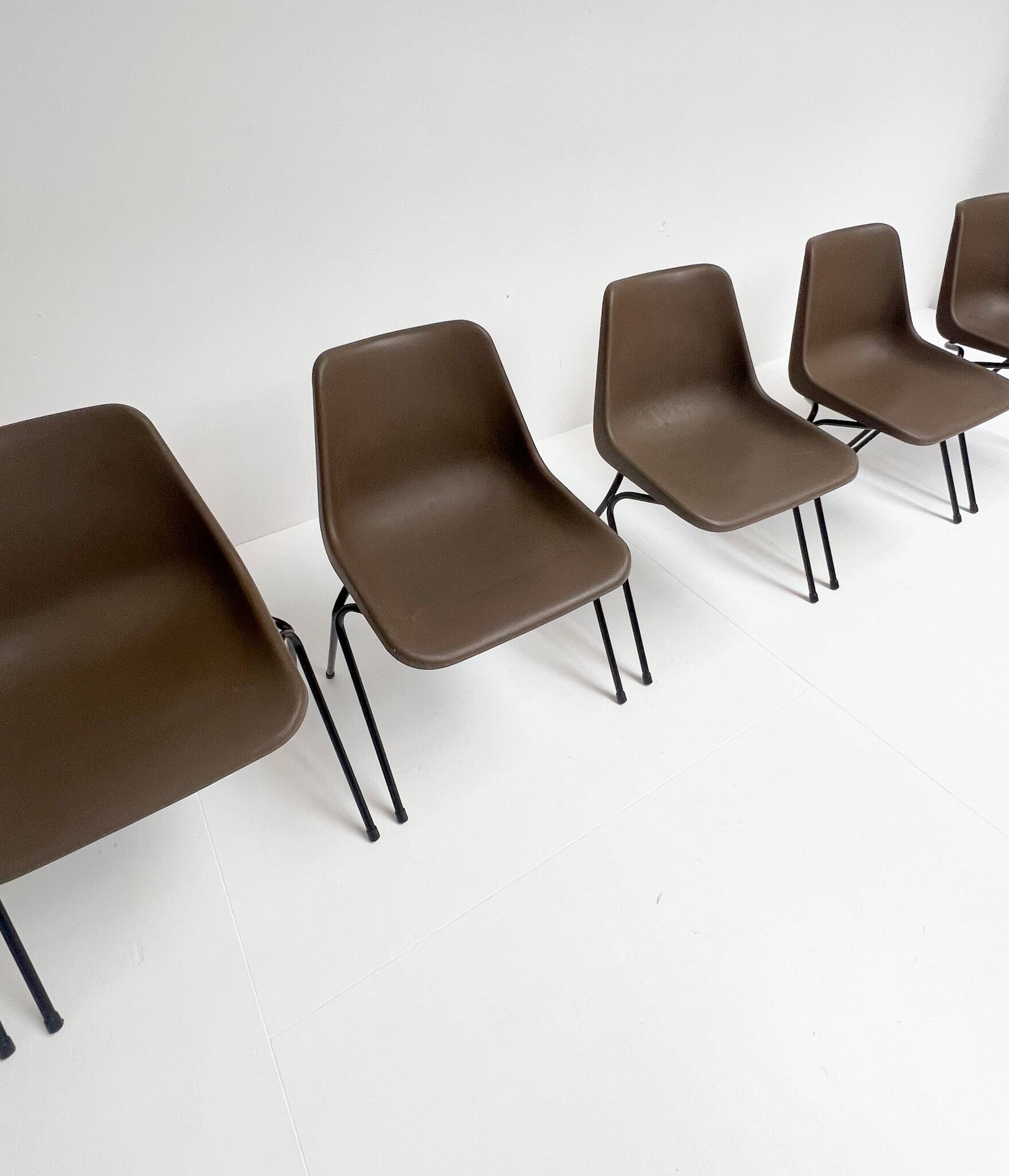 Brown and black set of 6 Polyprop chairs on a metal frame. The Polyprop cha