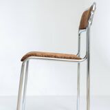 Chrome dining chair upholstered in brown bitten velvet.