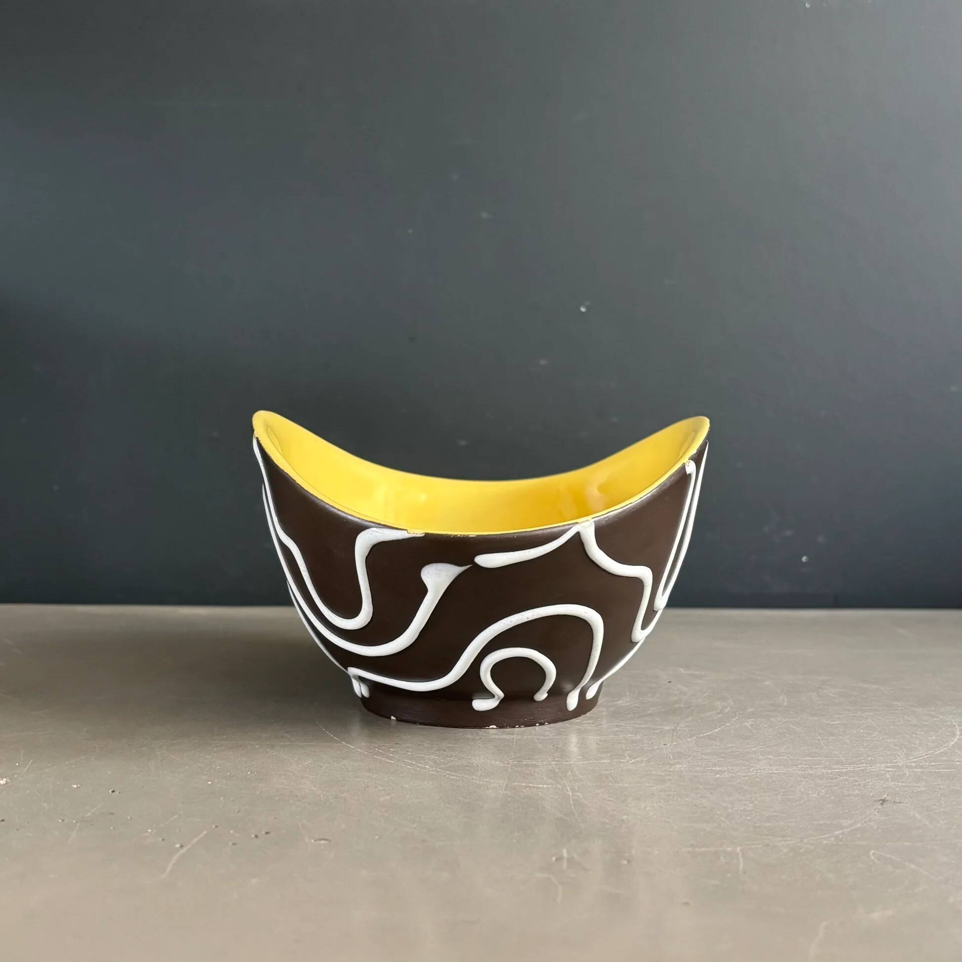Yellow and black ceramic aperitif bowl, free form, West Germany.