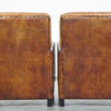 Set of 2 stylish yet comfortable armchairs made of sheepskin leather with a sleek design