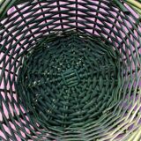 Green wicker basket with a large vintage handle